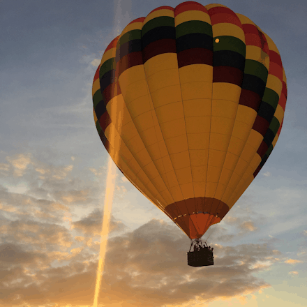 sunset hot air balloon ride just before landing