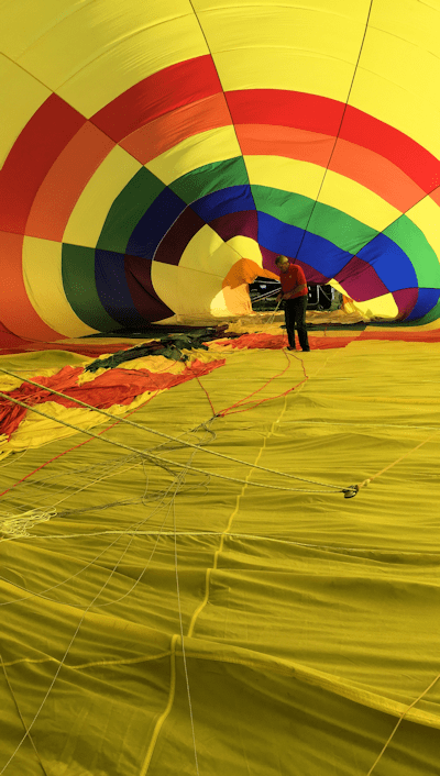 filling the hot air balloon with the fan